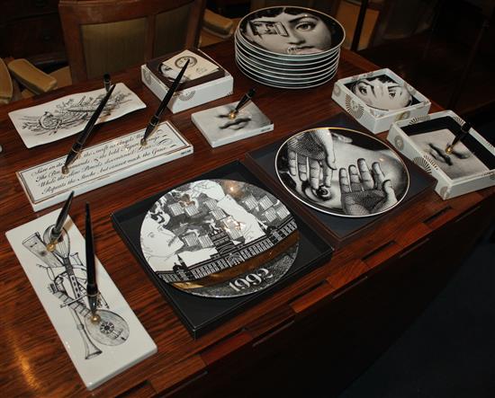 A collection of Fornasetti Temi e Variazioni and musical trophy pattern items,